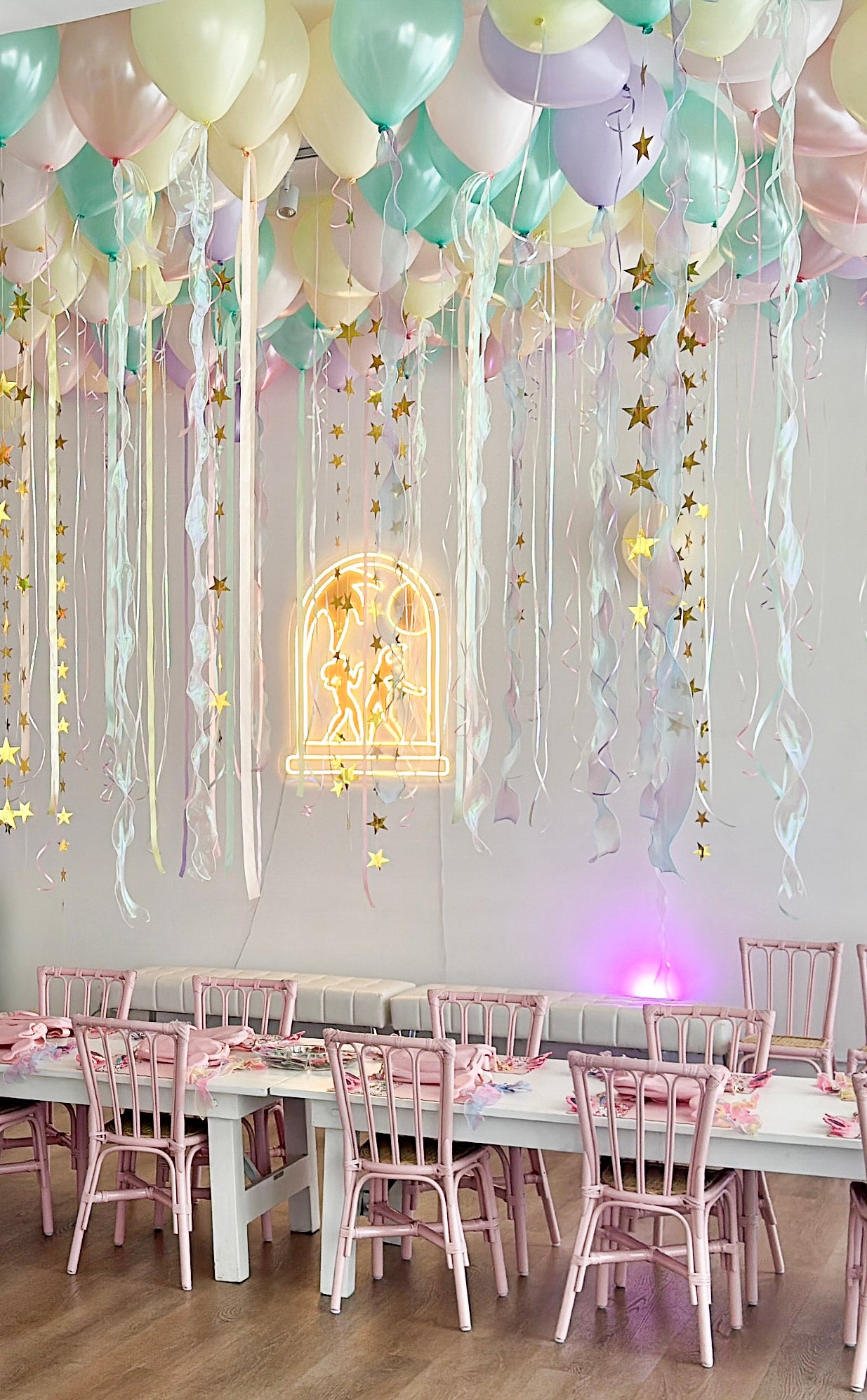 Light pink rattan kids chair at an event setup